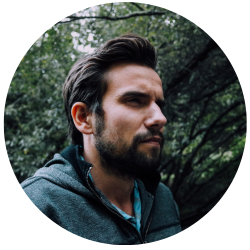 Man with a beard and short hair standing outdoors with trees in the background, Customer reviews